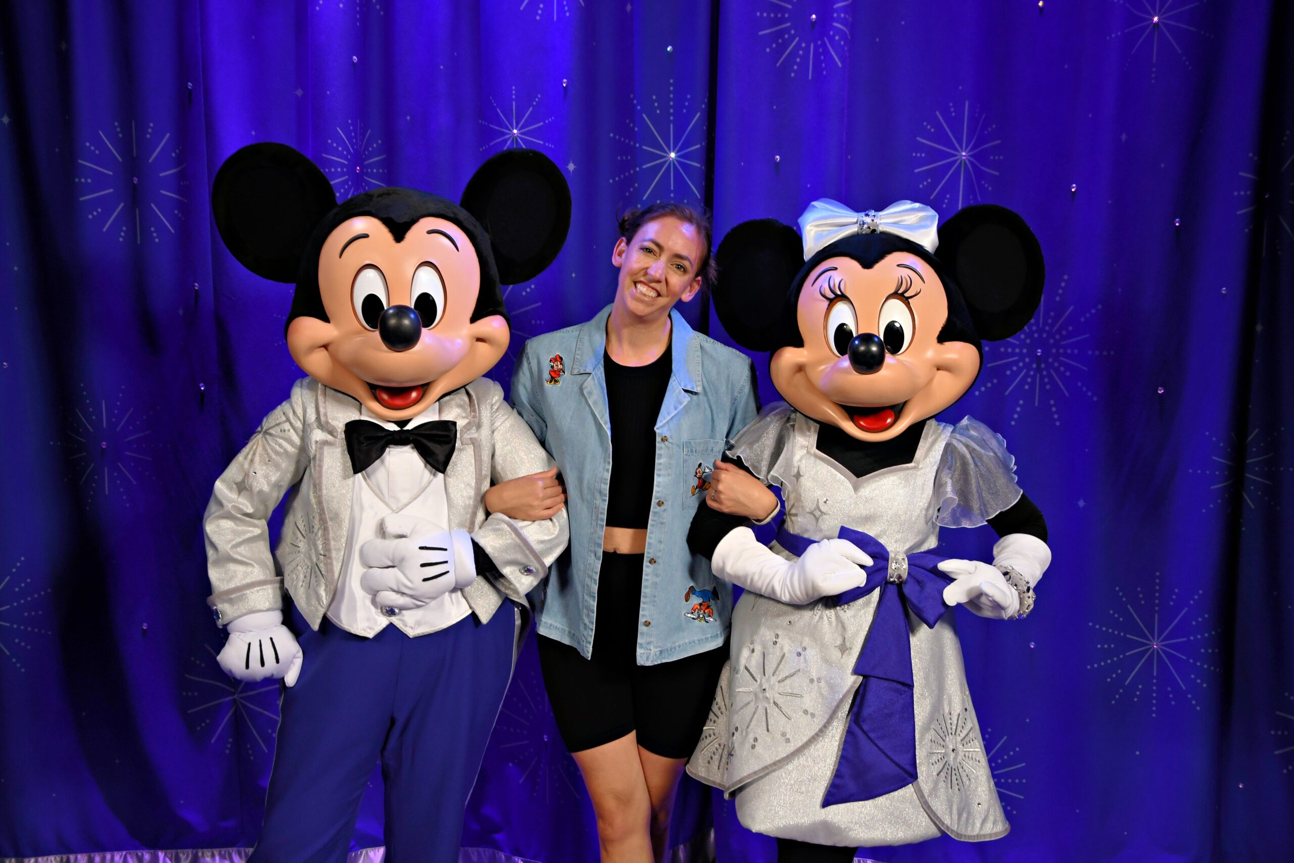 owner of Wishes Planning Services in arms with Mickey and Minnie Mouse at Walt Disney World